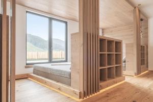 A bed or beds in a room at Lech Valley Lodge