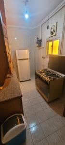 A kitchen or kitchenette at CozyHome 3BR Place Nasr City