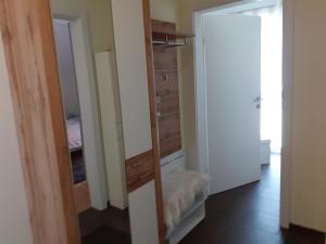 a room with a mirror and a closet at Villa Casa sol-rural residence near Linz in Katsdorf +19 photos