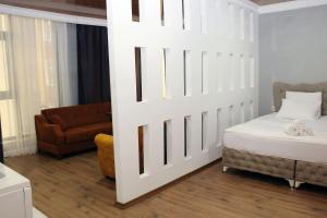 Postel nebo postele na pokoji v ubytování biglife hotel