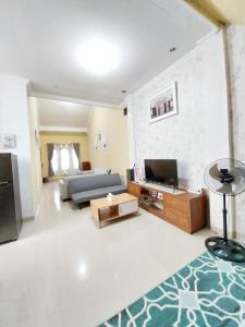 TV a/nebo společenská místnost v ubytování Guesthouse Hannia