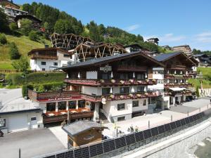 a large building on the side of a mountain at Apart-Hotel Forellenhof in Saalbach-Hinterglemm
