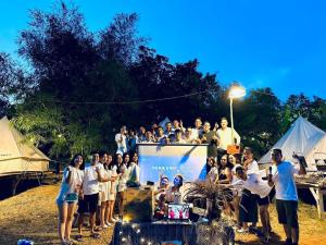 a group of people posing for a picture at a event at Gạo Farmstay in Ấp Vĩnh An Số