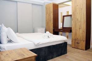 Postel nebo postele na pokoji v ubytování biglife hotel
