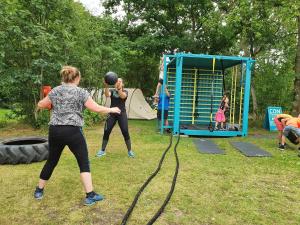 a group of people playing in a playground at Randers City Camp in Randers