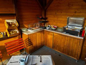 a kitchen with a counter with food on it at Filargo Apartmans - Cazare Sovata in Sovata