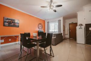 a dining room and living room with a table and chairs at Lovely, central 2BR home, just off St Julians w/AC by 360 Estates in Is-Swieqi +8 photos