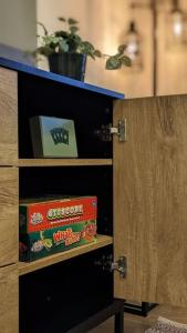 a book shelf with a box on top of it at 2 Bedroom apartment in Brean in Brean