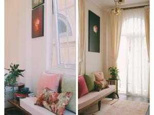 a living room with a couch and a window at Le Macaron City Center - Boutique Hotel Đà Lạt in Da Lat