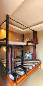 Postel nebo postele na pokoji v ubytování Pukka Hostel • El Nido
