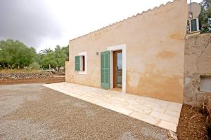 a building with a door on the side of it at Agroturisme Rafal Nou in Manacor