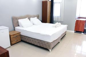Postel nebo postele na pokoji v ubytování biglife hotel