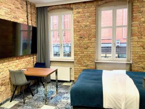 Apartamenty Browar Luxury Old Town Poznań 24h的电视和/或娱乐中心