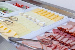 a tray of cheese and meats and other foods at Drevenica u Pavla in Ždiar
