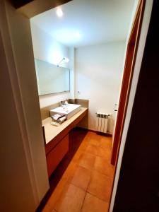 a bathroom with a sink and a mirror at Villa Solimar in L'Ampolla