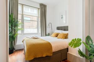 מיטה או מיטות בחדר ב-Prime Apartments Gloucester Road