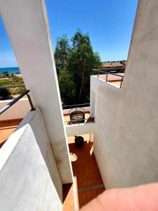 an overhead view of a balcony with a view of the ocean at Villa Solimar in L'Ampolla