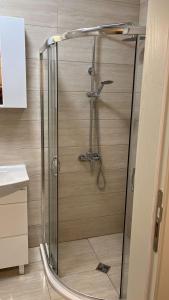 a shower with a glass door in a bathroom at VALENCIA GARDENS ROYAL in Nesebar +38 photos