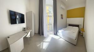Cama o camas de una habitación en Dimora Chiaia 209
