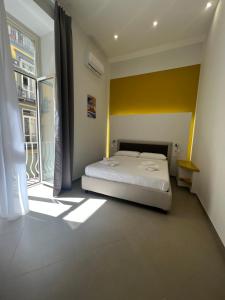 Cama o camas de una habitación en Dimora Chiaia 209