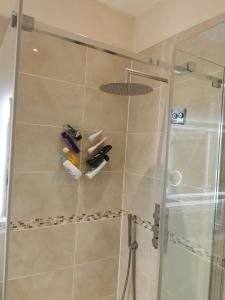 a bathroom with a shower with a glass door at Large Double Room with Private Toilet and Shower in Southend-on-Sea