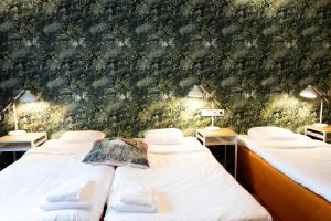 Postel nebo postele na pokoji v ubytování Hotel Finn