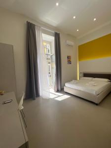 Cama o camas de una habitación en Dimora Chiaia 209