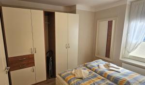 Postel nebo postele na pokoji v ubytování Das Haus zum kleinen Versteck Appartement 5