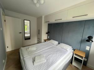 Posteľ alebo postele v izbe v ubytovaní LTC Apartments Wzgórze św Maksymiliana