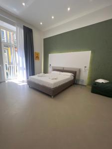Cama o camas de una habitación en Dimora Chiaia 209