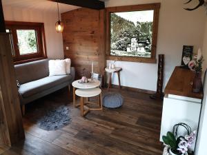 a living room with a couch and a table at Bergführerhaus in Ramsau am Dachstein