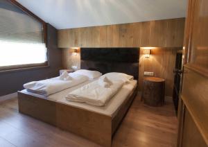 A bed or beds in a room at Appart Laijola