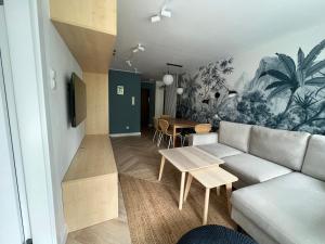 Televízia a/alebo spoločenská miestnosť v ubytovaní LTC Apartments Wzgórze św Maksymiliana