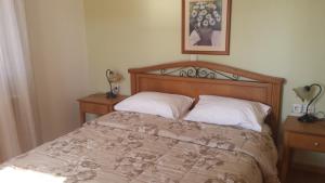 Ένα ή περισσότερα κρεβάτια σε δωμάτιο στο Sirines Apartments