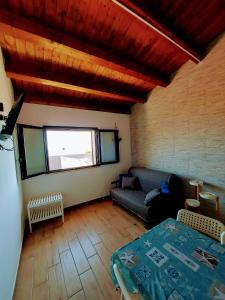 A bed or beds in a room at Terrazza del Golfo