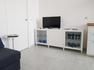 TV a/nebo společenská místnost v ubytování L'artavello alloggio turistico
