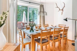 a dining room with a table and chairs at Ferienhaus Florianiweg in Bad Gastein