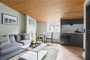 a living room with a couch and a table at At Old Town Aparthotel in Stockholm