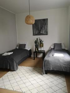 Postel nebo postele na pokoji v ubytování Quality Apartments Nature
