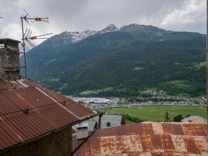 a view of a town with mountains in the background at Luxury apartment in Bormio - Centrale 69 in Piatta