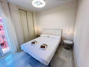 a bedroom with a bed with two baskets on it at PUSHE Playa Granada Beach & Golf 17 in Motril +29 photos