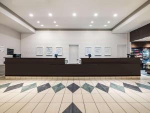 an empty store lobby with counters and a tiled floor at Hilton Garden Inn Chicago Downtown/Magnificent Mile in Chicago