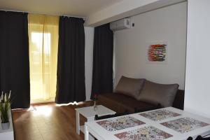 a living room with a couch and a table at B&B apartments in Star Dojran