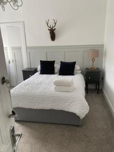 Postel nebo postele na pokoji v ubytování Giffnock Rooms + 5 fotografií