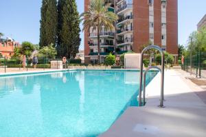 a large swimming pool in a apartment complex at Las Estrellas 301 in Torremolinos
