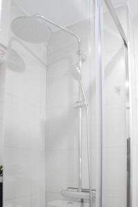 a shower with a glass door in a bathroom at Las Estrellas 301 in Torremolinos
