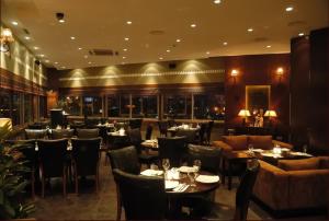 A restaurant or other place to eat at Galaxy Amman Hotel