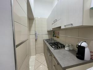 A kitchen or kitchenette at Casa Rodan Napoli Centro