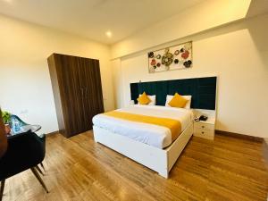 Llit o llits en una habitació de Amahi Inn