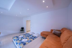 En eller flere senge i et værelse på Casa Astrid Werner - Happy Rentals